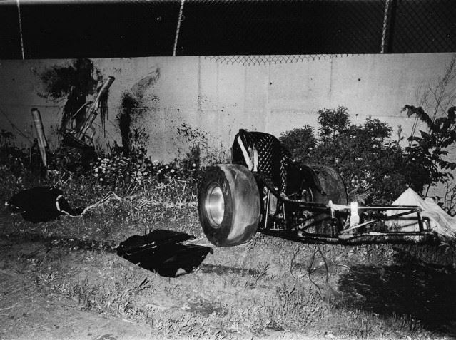 Remnants of a Go-Kart by a Concrete Wall