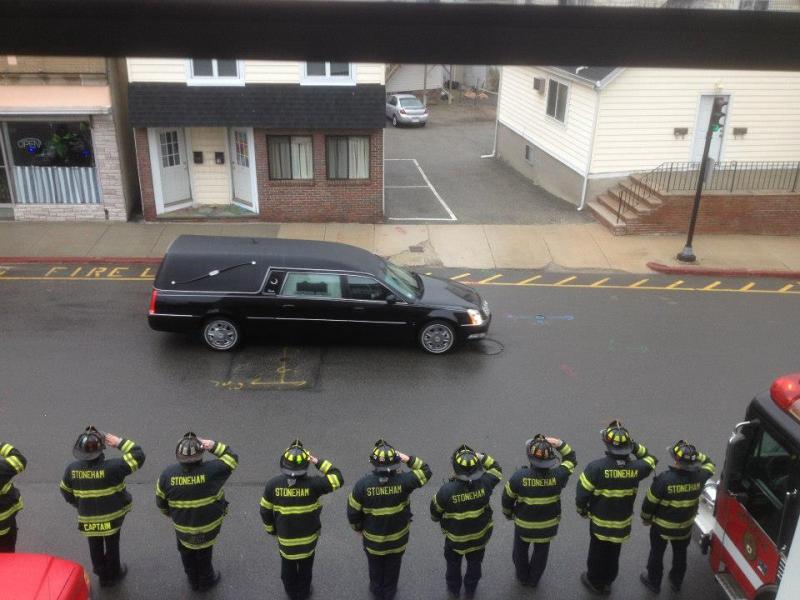 Stoneham Firefighters Pay Tribute to MIT Police Officer Sean Collier as the Procession Passes the Fi
